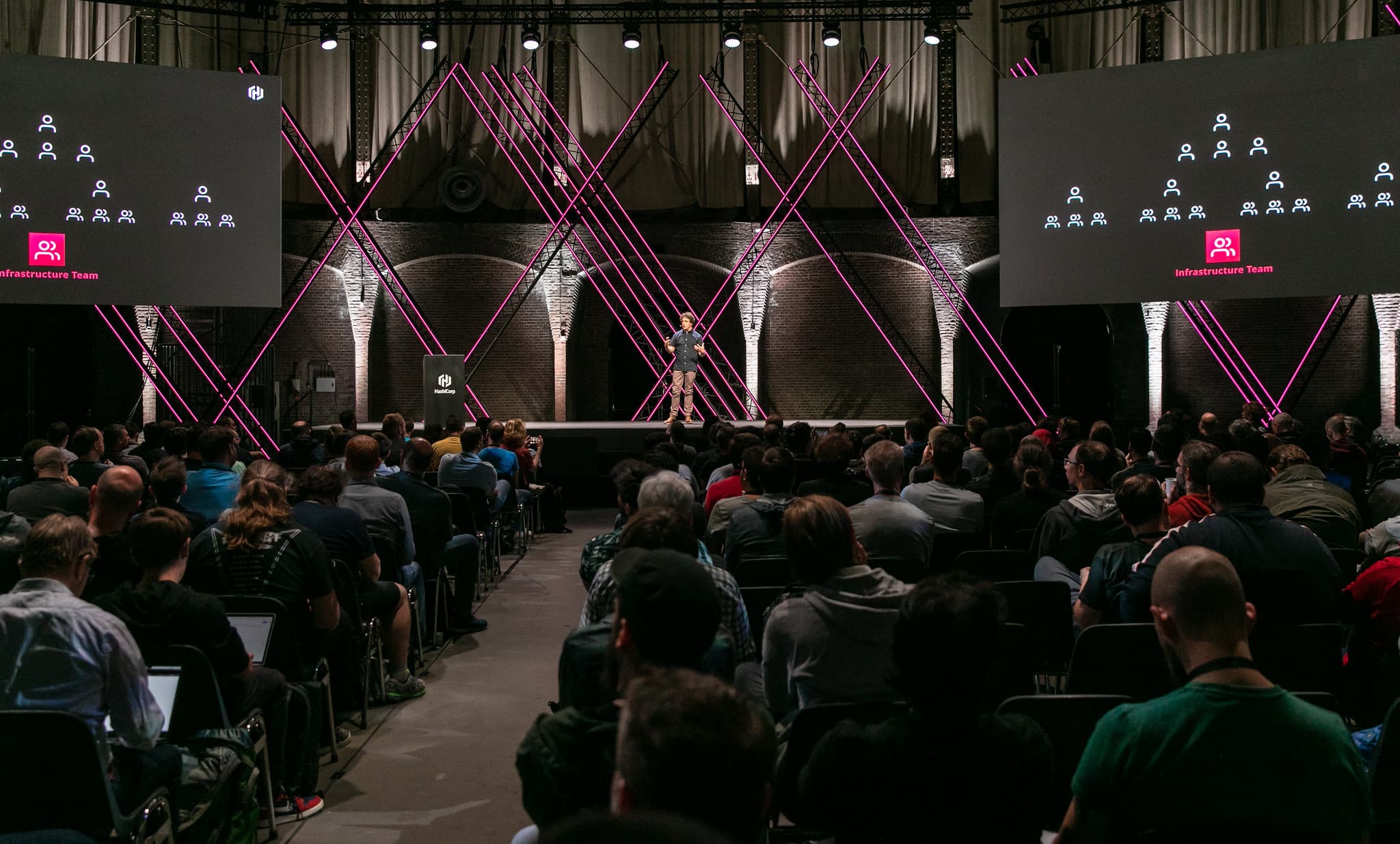 HashiConf speaker on stage with audience